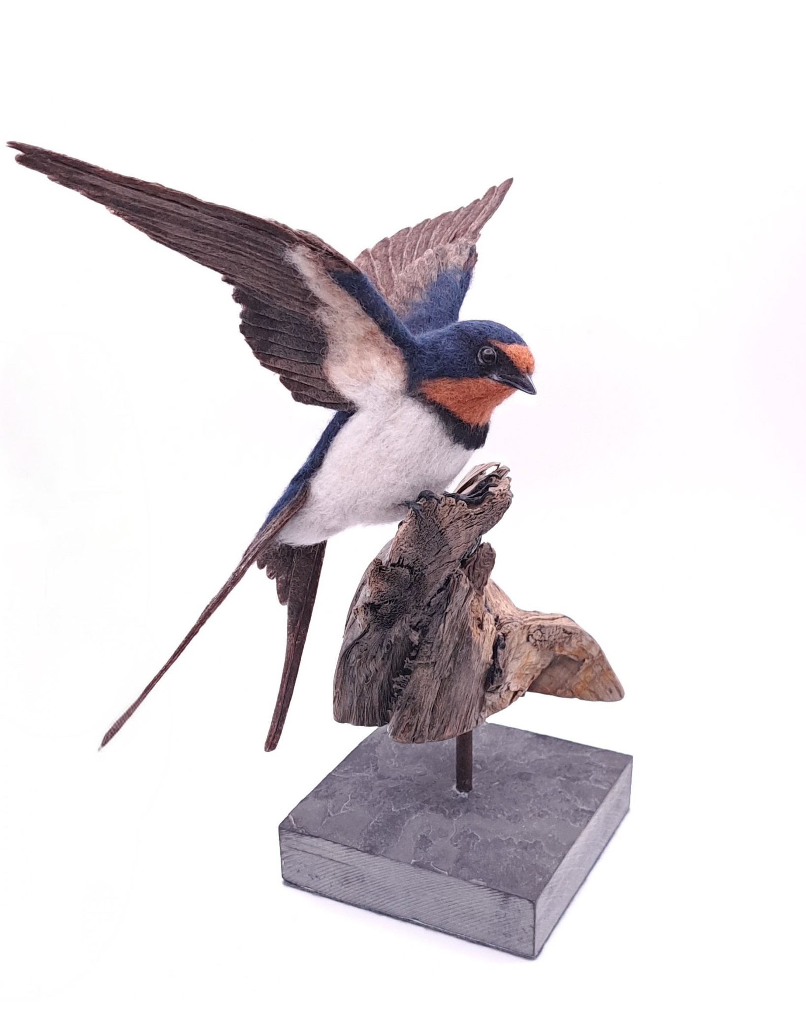 Needle felted swallow mounted on driftwood and slate.