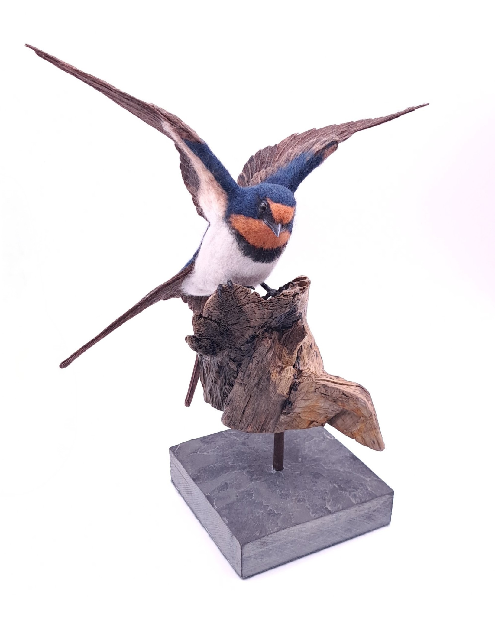 Needle felted swallow mounted on driftwood and slate.